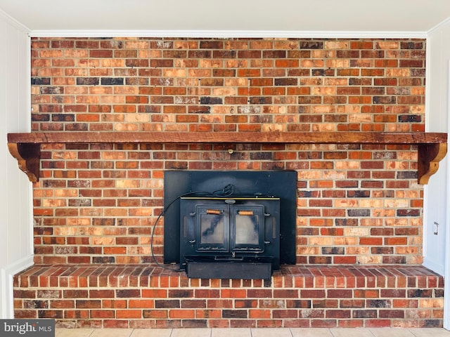 room details with a wood stove and crown molding