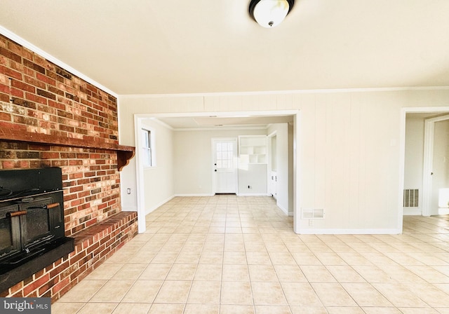 unfurnished living room featuring light tile patterned floors and ornamental molding