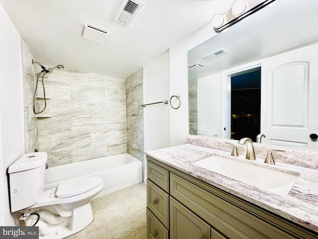 full bathroom with vanity, toilet, and tiled shower / bath combo