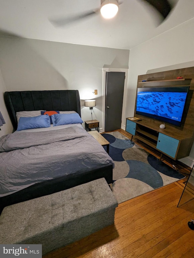 bedroom featuring ceiling fan and hardwood / wood-style floors