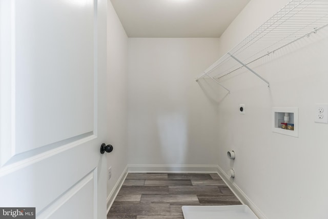 laundry area with hookup for an electric dryer, washer hookup, dark hardwood / wood-style floors, and gas dryer hookup