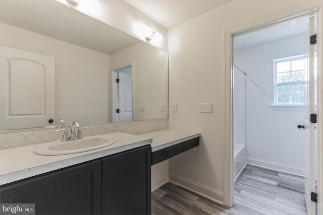 bathroom with wood-type flooring and vanity