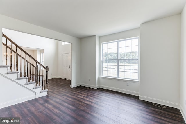 interior space with dark hardwood / wood-style flooring