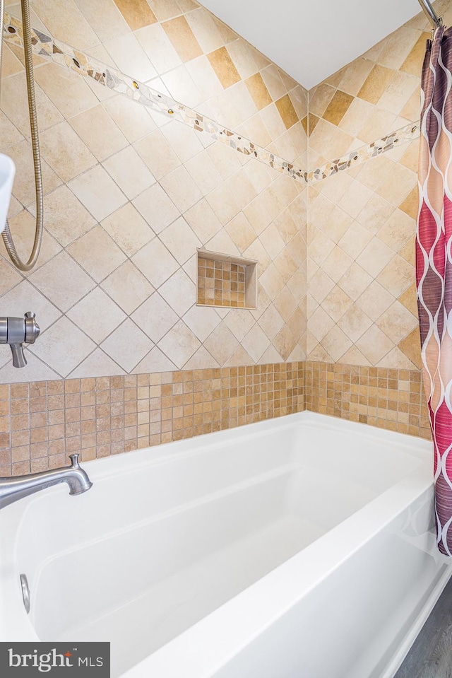 bathroom featuring curtained shower