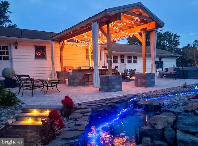 view of patio / terrace featuring an outdoor bar