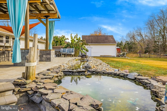 view of patio with an outdoor structure