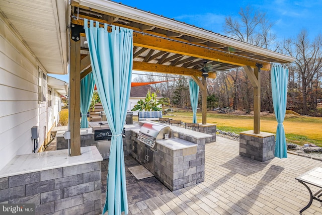 view of patio / terrace with a gazebo, area for grilling, and a grill