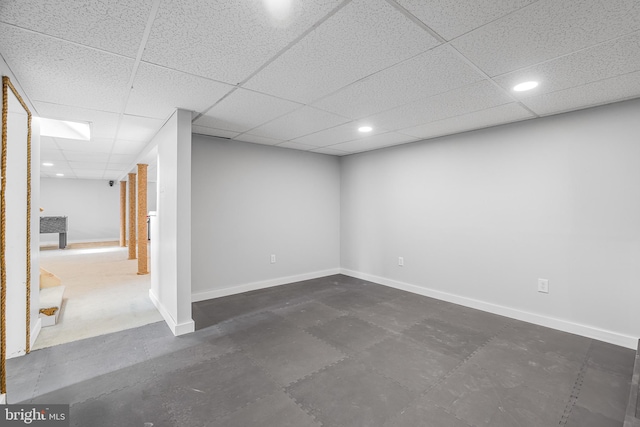 basement featuring a paneled ceiling