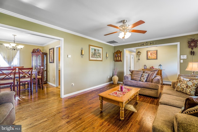 living room featuring a baseboard heating unit, ceiling fan with notable chandelier, hardwood / wood-style flooring, and crown molding