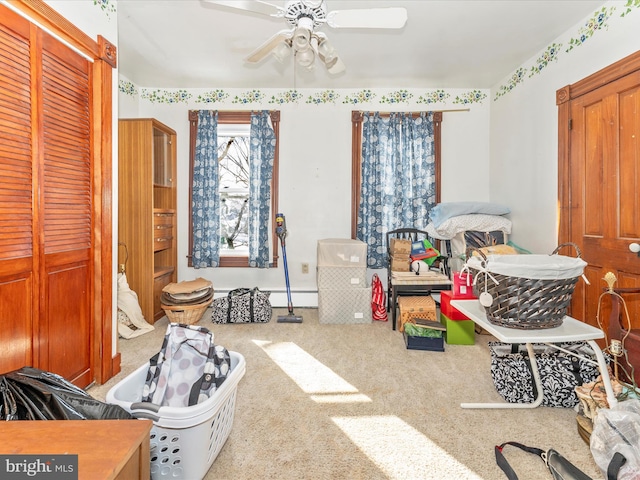 playroom featuring a baseboard radiator, ceiling fan, and carpet flooring