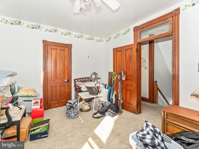 recreation room with carpet and ceiling fan