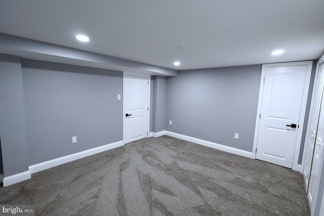 basement with dark carpet