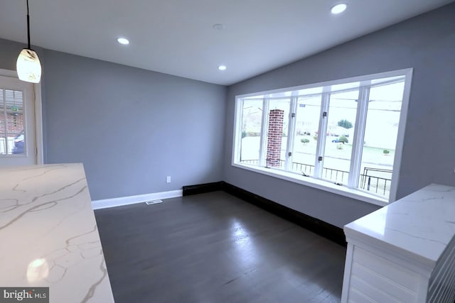 dining area featuring dark hardwood / wood-style flooring and lofted ceiling