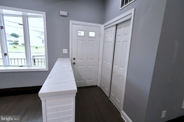 doorway to outside with dark hardwood / wood-style flooring