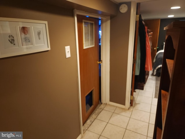 hallway with light tile patterned floors