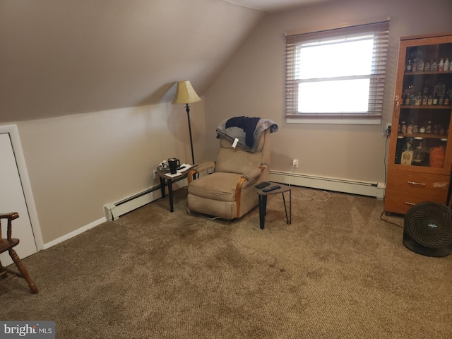 living area with carpet flooring, vaulted ceiling, and a baseboard heating unit