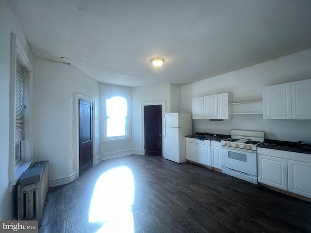 kitchen with white cabinetry, dark hardwood / wood-style flooring, white appliances, and radiator heating unit