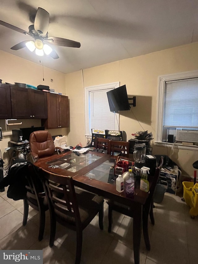 tiled dining space with ceiling fan and cooling unit