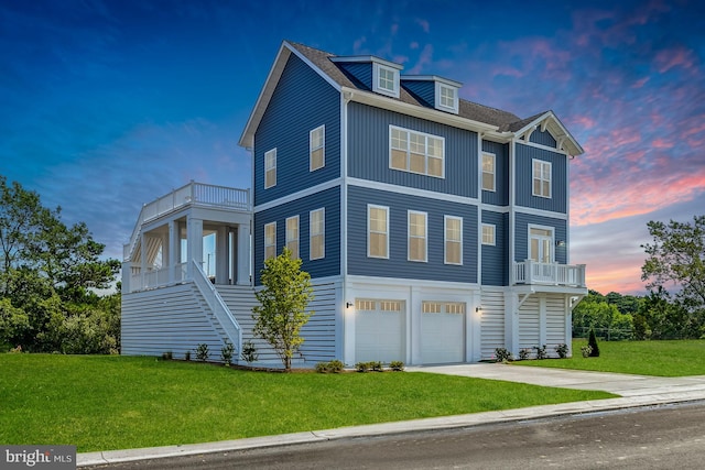 30461 Blue Beech Ln, Frankford, DE 19945 - raised beach house featuring a balcony, an attached garage, a front lawn, concrete driveway, and board and batten siding