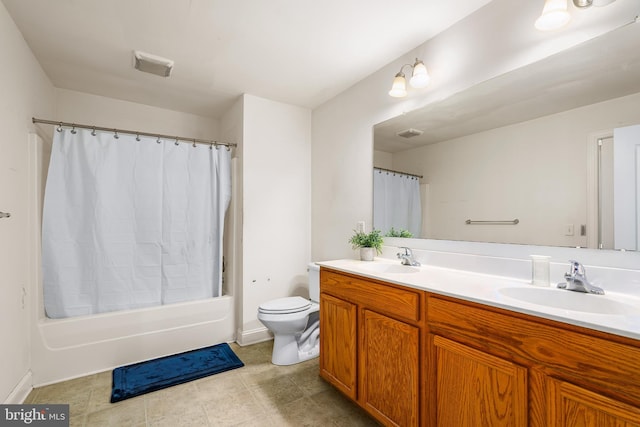 full bathroom featuring tile patterned floors, vanity, shower / bath combination with curtain, and toilet