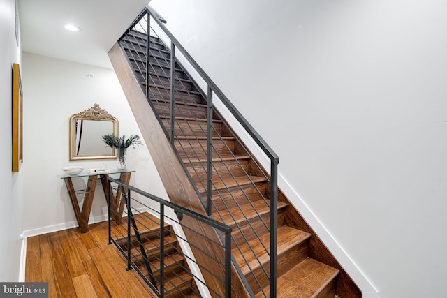 stairs with wood-type flooring