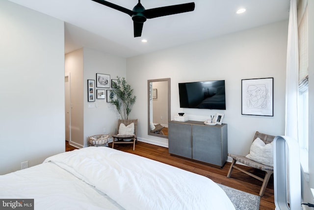 bedroom with ceiling fan and dark wood-type flooring