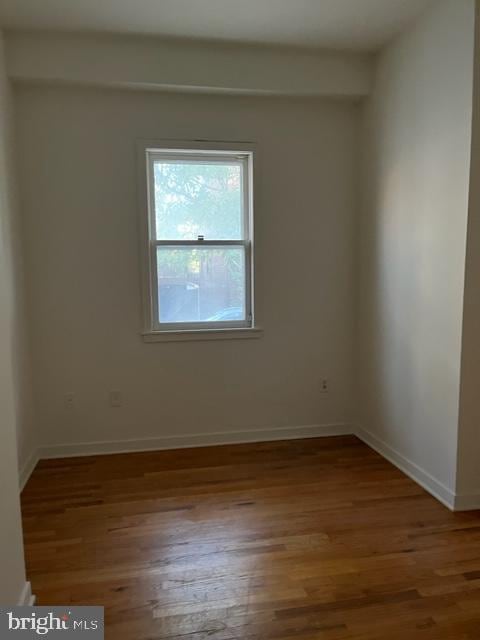 empty room featuring hardwood / wood-style flooring