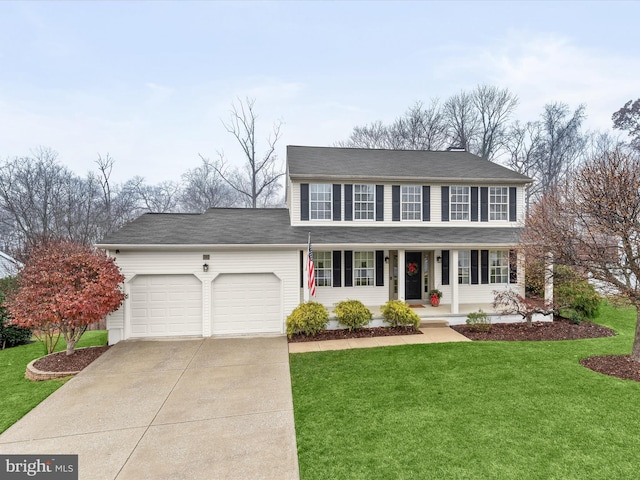 view of front facade with covered porch, a garage, and a front lawn