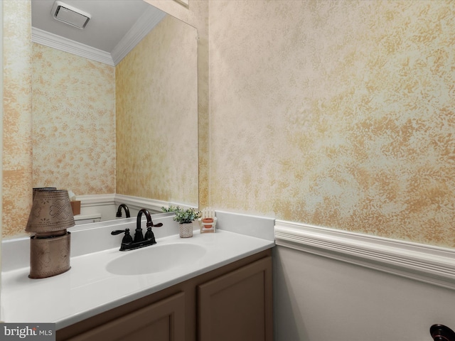 bathroom featuring vanity and ornamental molding