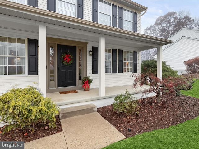 entrance to property with covered porch