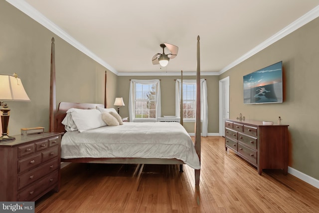 bedroom with light hardwood / wood-style floors and ornamental molding