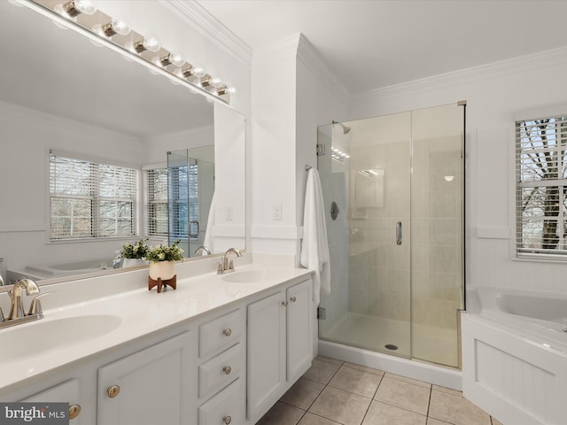 bathroom with crown molding, tile patterned flooring, vanity, and walk in shower