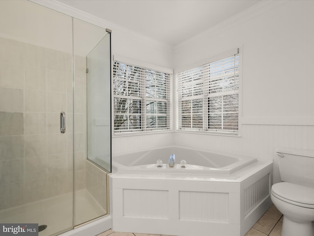 bathroom featuring toilet, tile patterned flooring, ornamental molding, and shower with separate bathtub