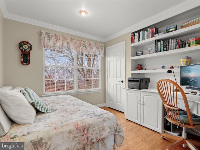 bedroom with light hardwood / wood-style flooring and crown molding