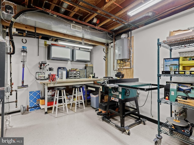 basement featuring a workshop area and water heater