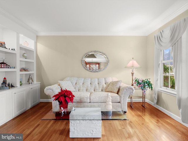 living room with light wood-type flooring and crown molding