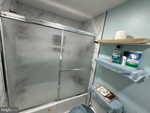 bathroom featuring enclosed tub / shower combo