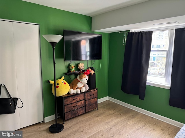 bedroom with light hardwood / wood-style flooring