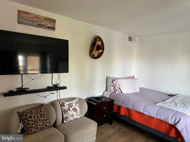 bedroom featuring hardwood / wood-style flooring