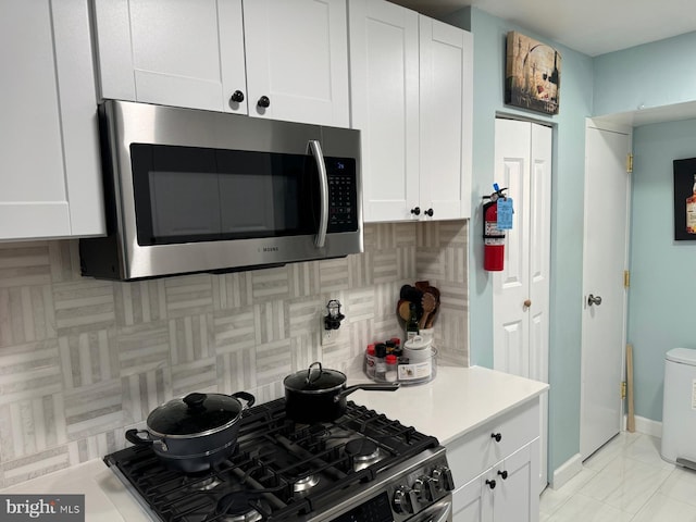 kitchen featuring white cabinetry and stainless steel appliances