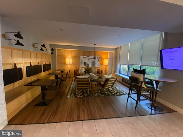 dining space with wood-type flooring