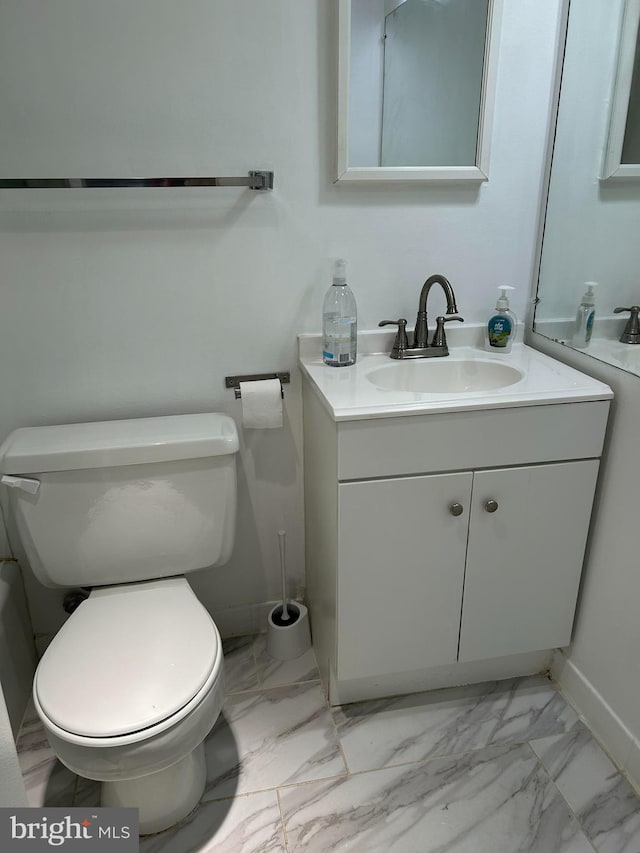 bathroom with vanity and toilet