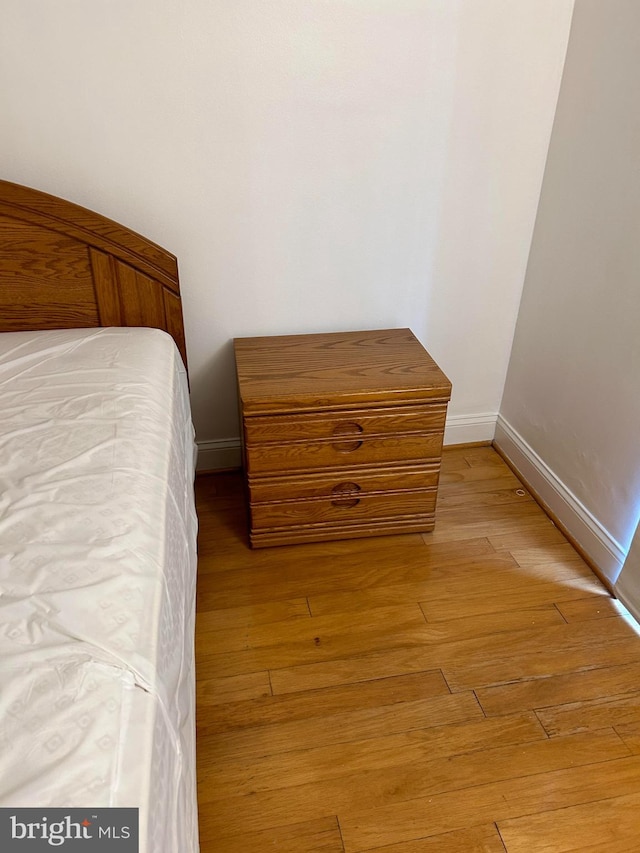 bedroom with light hardwood / wood-style flooring