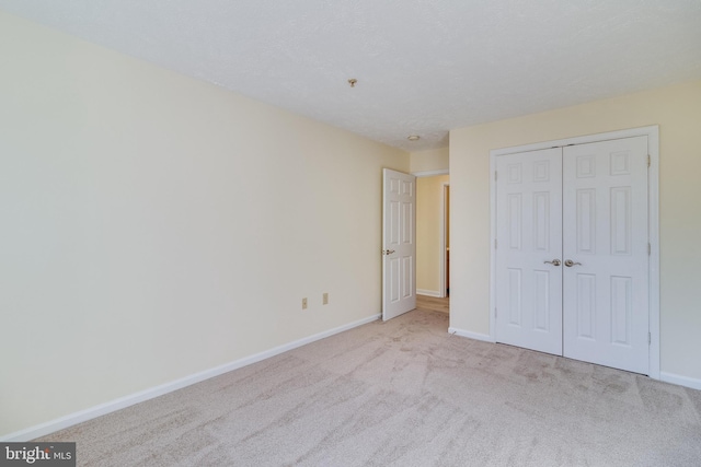 45512 Westmeath Unit B21, Great Mills, MD 20634 - unfurnished bedroom featuring baseboards, carpet, and a closet
