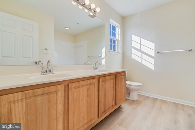 45512 Westmeath Unit B21, Great Mills, MD 20634 - full bathroom featuring double vanity, toilet, and wood finished floors
