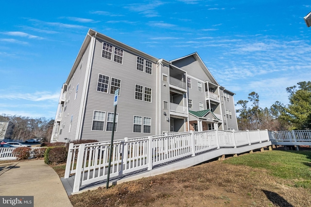 exterior space with a yard and a wooden deck