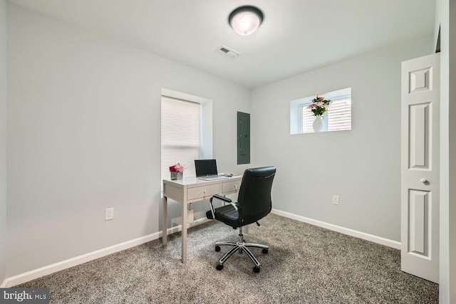 office space with carpet flooring and electric panel