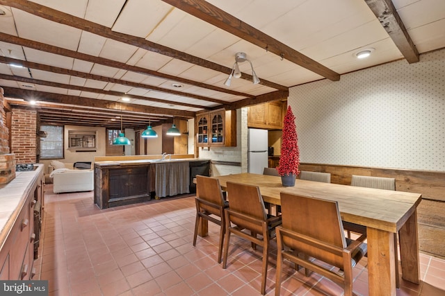 dining room with beam ceiling