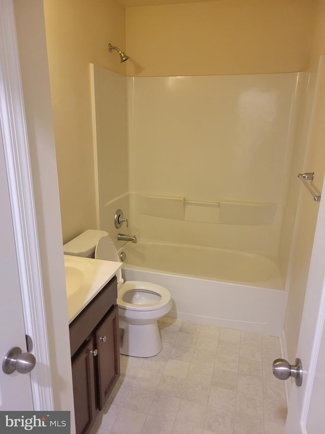 full bathroom with bathing tub / shower combination, vanity, and toilet