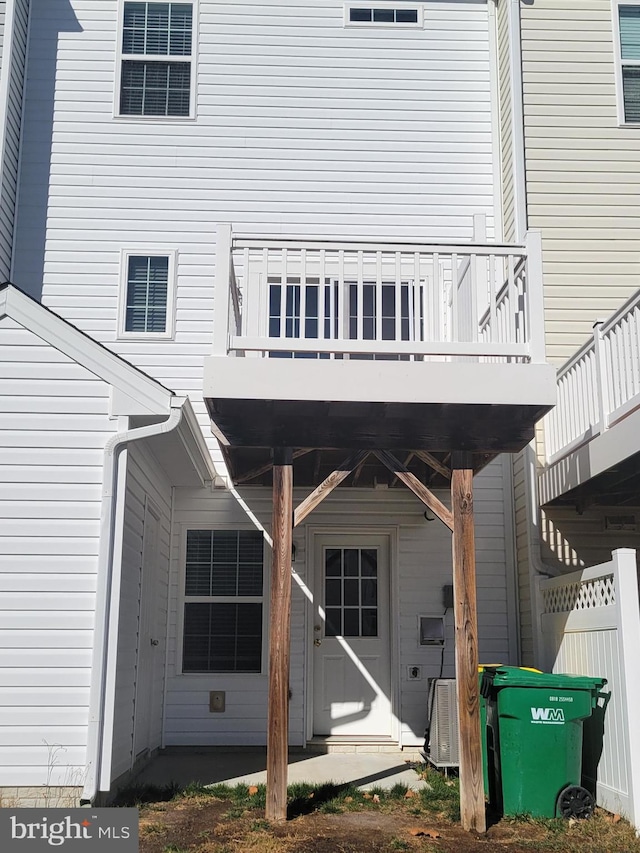 back of property featuring a wooden deck